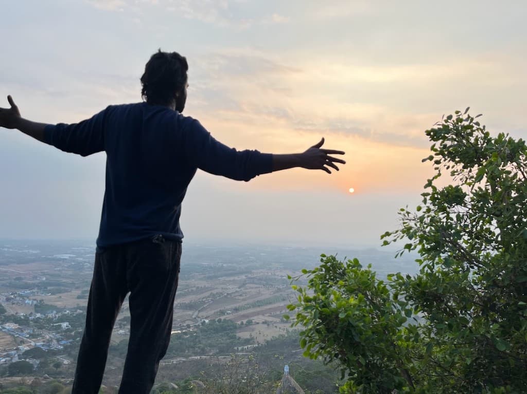 Standing on a hill at sunset, looking out over the valley.