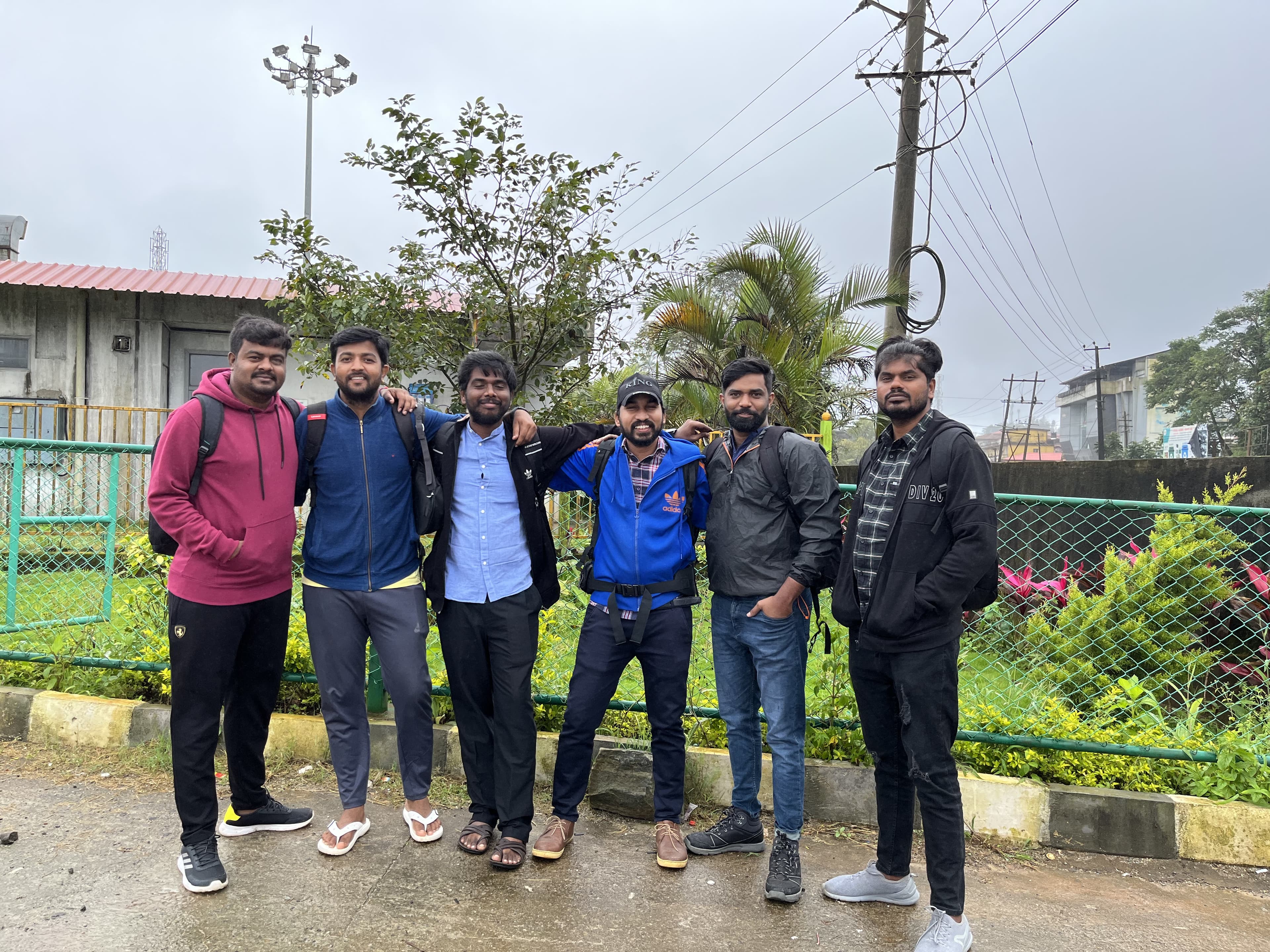 The group standing together in Coorg, after rain.