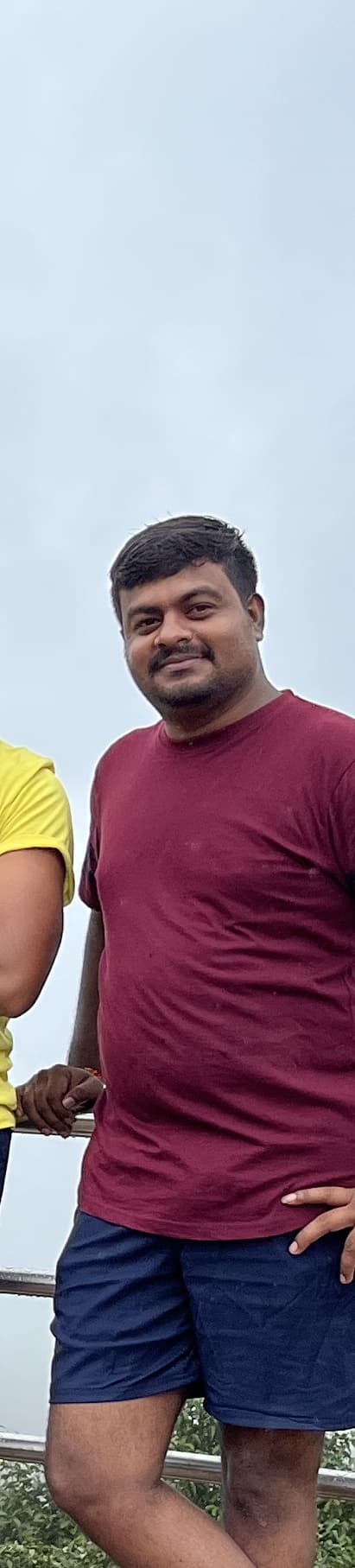 Sridhar in a maroon t-shirt at the Coorg viewpoint.